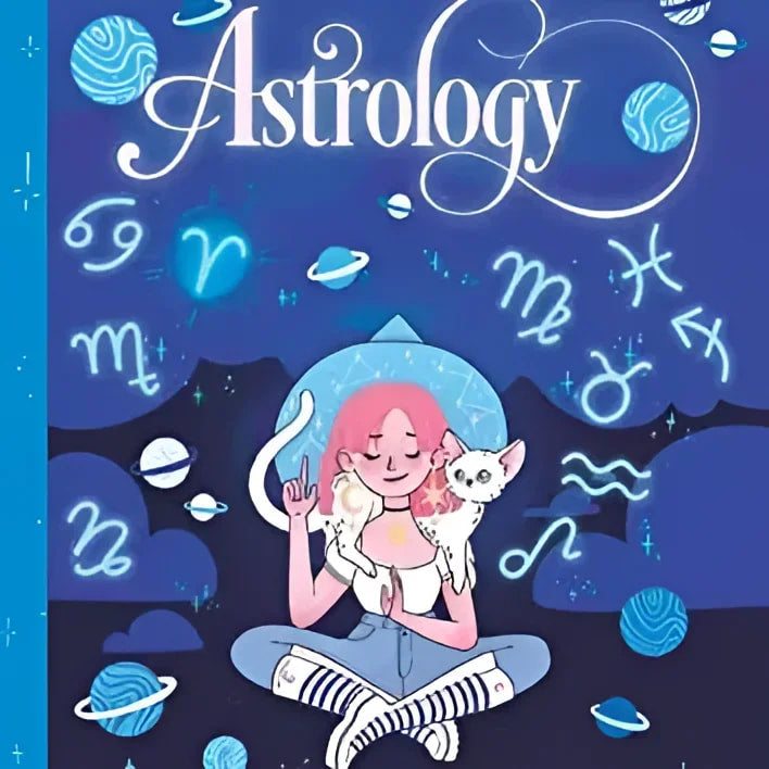 A person sitting on a book titled ’Teen Witches’ Guide To Astrology’ with a cat nearby