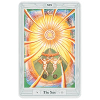 The thoth tarot deck small by aleister crowley features the sun tarot card with a golden sun and zodiac signs
