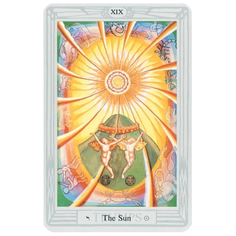 The thoth tarot deck small by aleister crowley features the sun tarot card with a golden sun and zodiac signs