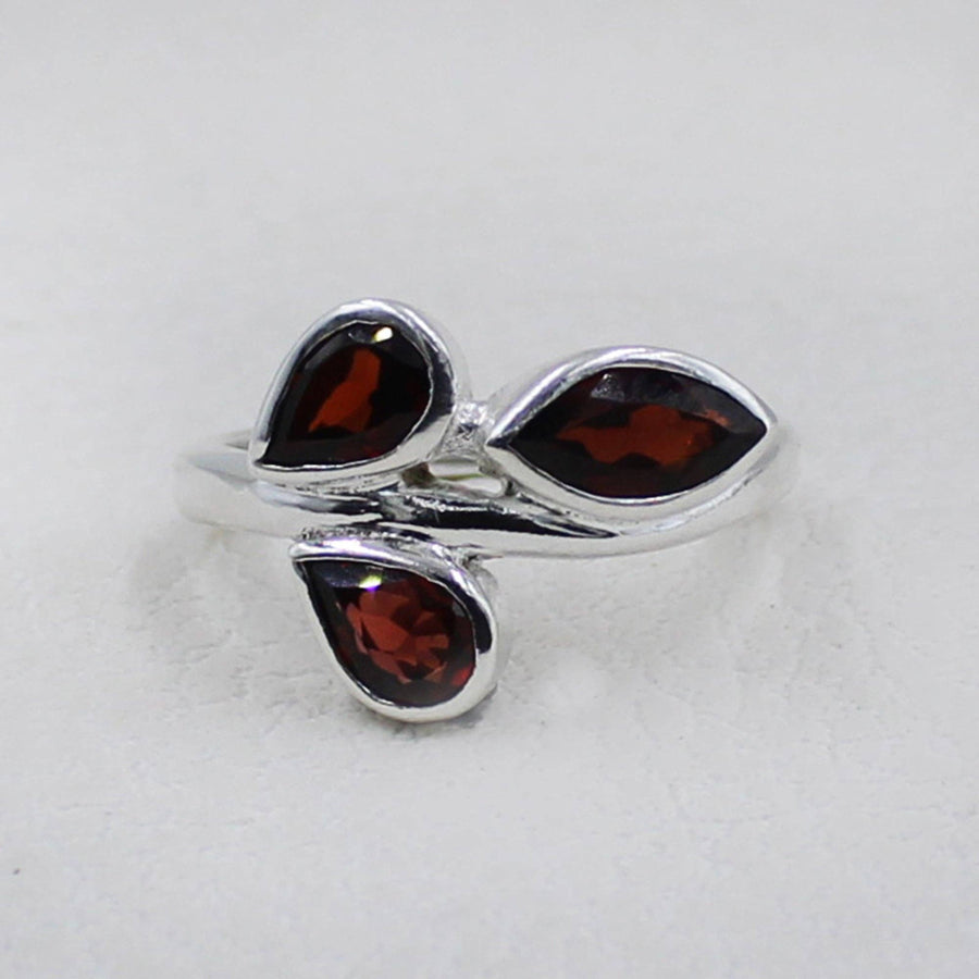 Sterling silver ring with three teardrop garnet stones in leaf design #BC0405
