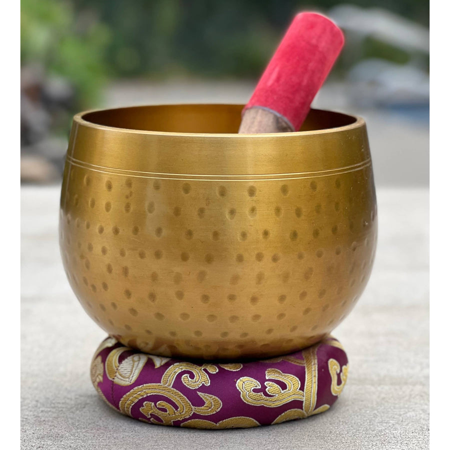 Golden Singing Bowl with Mallet on Purple Cushion from Tibetan Brass Gong Meditation Set