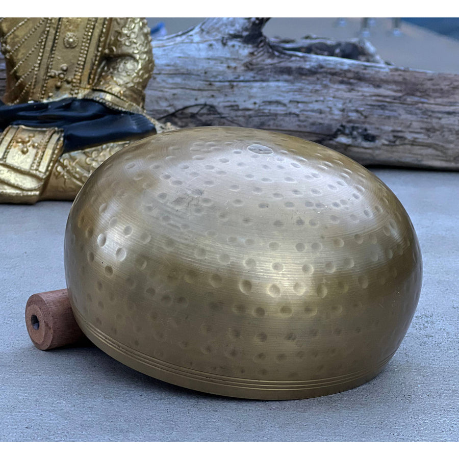 Golden singing bowl with mallet for meditation from Tibetan Brass Gong Complete Set