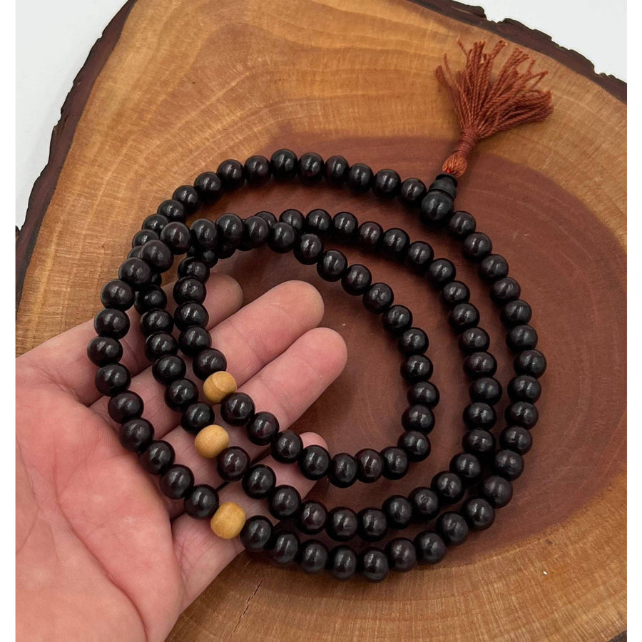 Black beaded mala with tassel for Tibetan Buddhist prayer and meditation rituals