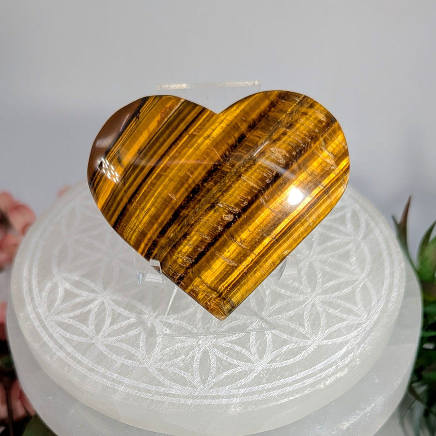 Heart-shaped Tiger’s Eye stone in a 2.5-inch size for jewelry and decor displays
