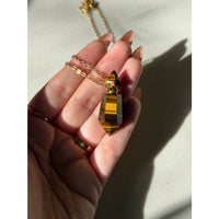 Golden tiger eye pendulum pendant with amber-brown striped gem on 18k gold chain