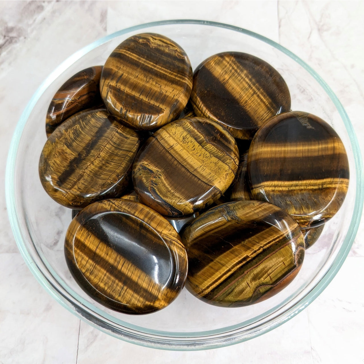 Tiger’s Eye gems in a bowl featured in the Tiger’s Eye Gold Thumb Stone #LV2266