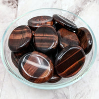 Thumbnail for Tiger’s Eye red thumb stones in a bowl, perfect for healing and energy balance
