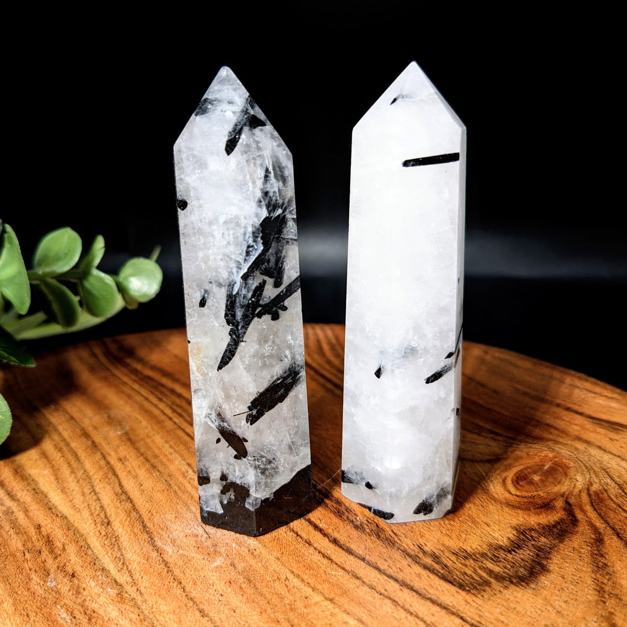 Tourmalinated 3.3’ Quartz Tower #LV2166 featuring two quartz crystals on a wooden table