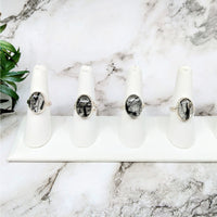 Thumbnail for Three white candles on a marble counter next to Tourmalinated Quartz .6’ Oval S.S. Ring #LV4612