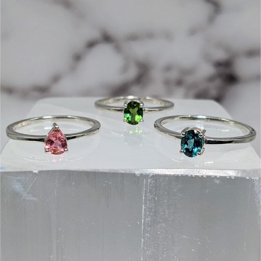 Colorful tourmaline gems on marble block highlight Tourmaline S.S. Faceted Ring #LV3879