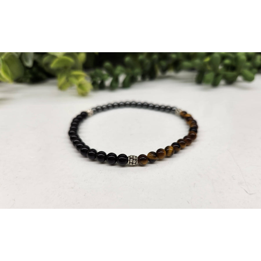 Triple Protection black and brown beaded bracelet with silver charm