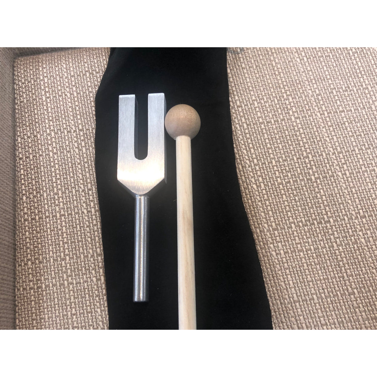 Tuning fork displayed with a fork and knife on black cloth - Small 4’ Metal 4096 C Hz #W012