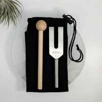 Small 4-inch metal tuning fork with mallet and pouch for tuning and testing musical instruments