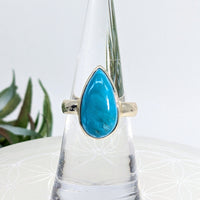 Turquoise teardrop ring in size 6.5 with Sterling Silver setting displayed