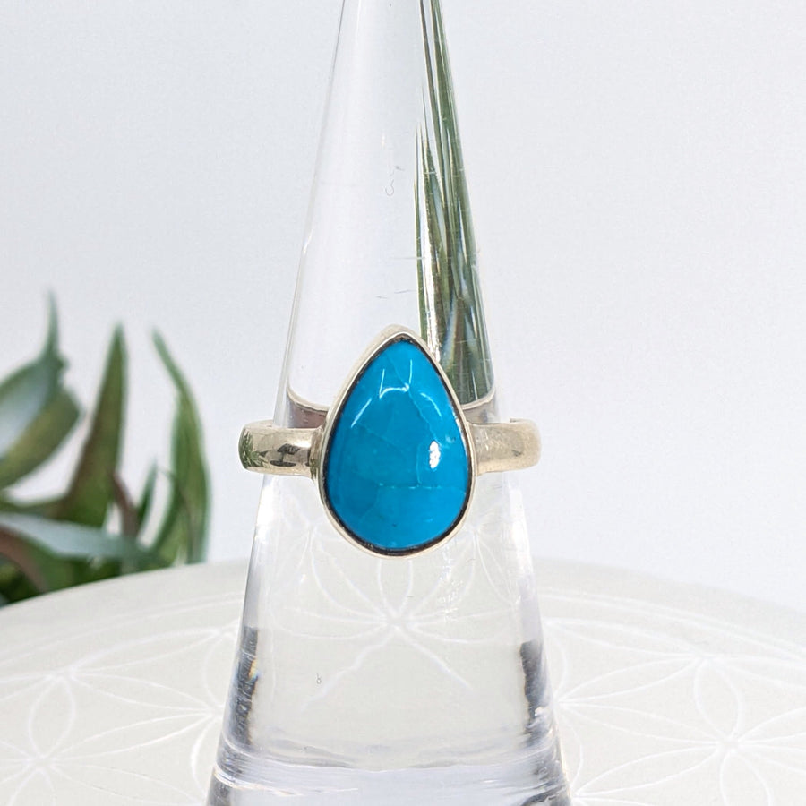 Teardrop turquoise ring in size 6 displayed on a silver band, elegant jewelry accessory