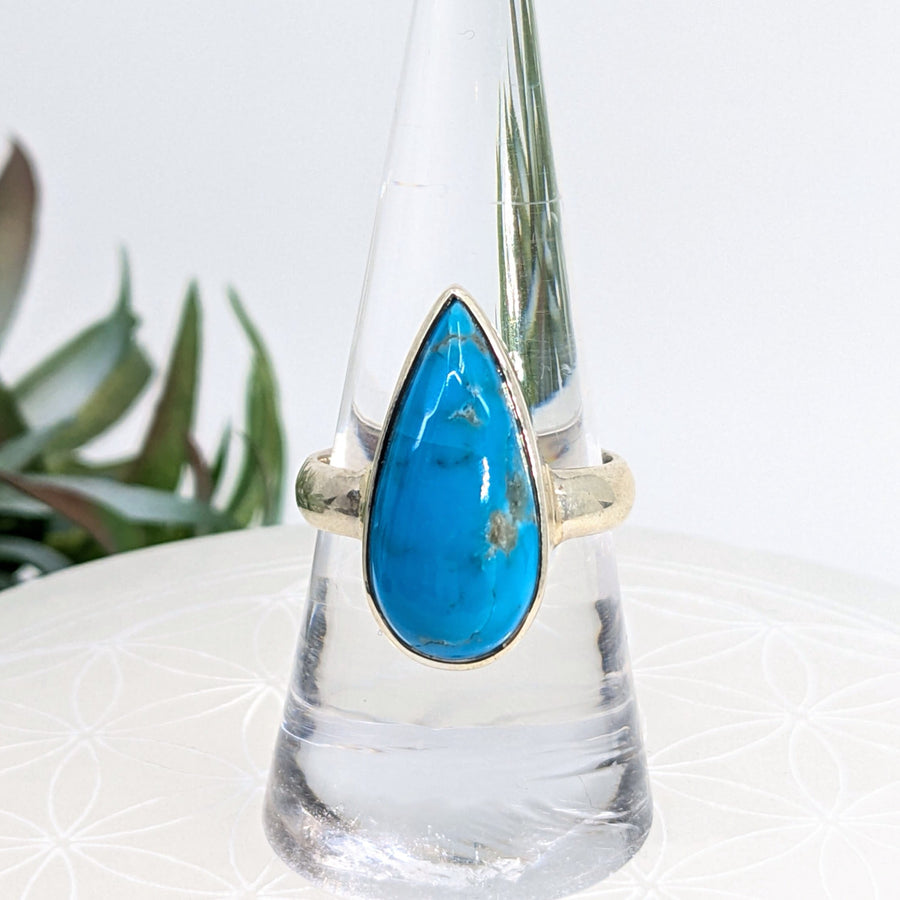 Teardrop turquoise ring in size 8.5 with sterling silver band displayed for sale