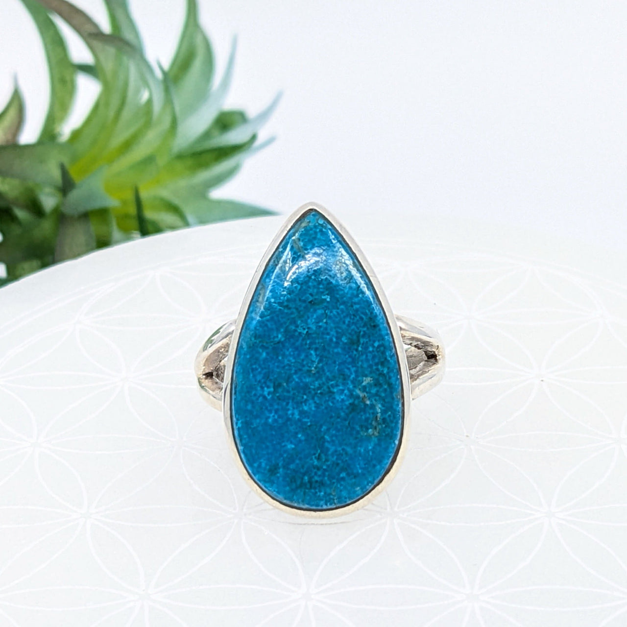 Teardrop ring featuring a turquoise stone set in a silver design, size 9.75