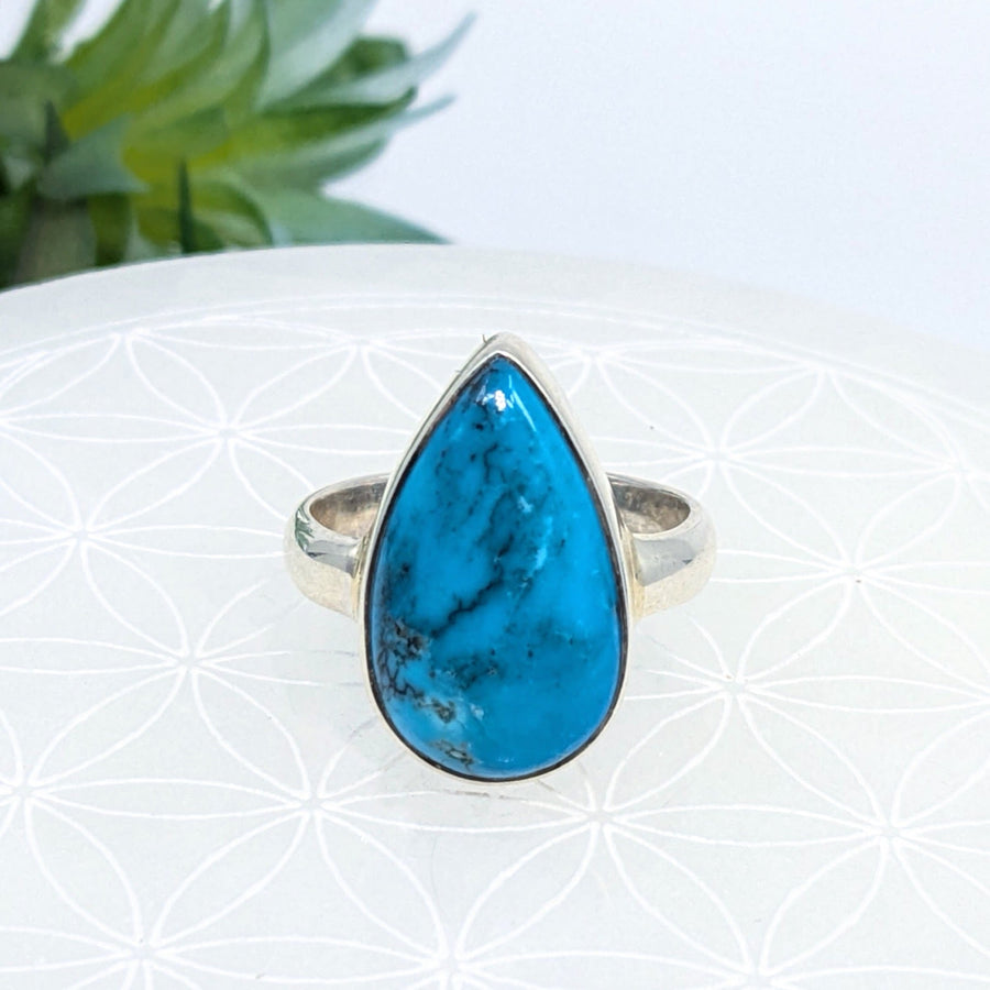 Teardrop ring featuring a turquoise stone set in silver, size 9.75