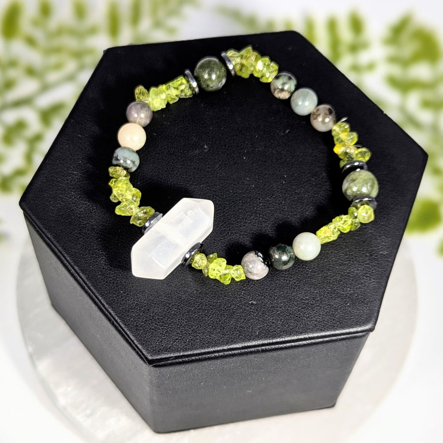 Uplifting 7 inch multi stone jewelry bracelet with lime green crystals white and gray gemstones and a hexagonal centerpiece crystal