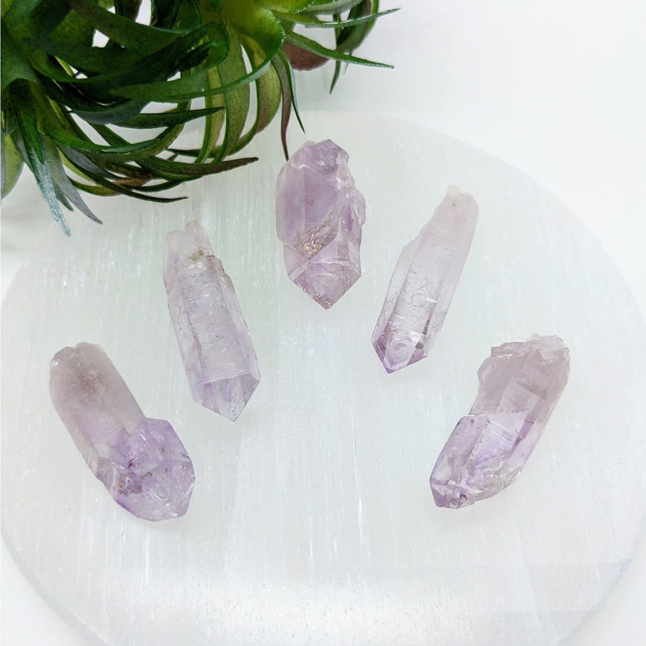 Veracruz Amethyst Crystals 1.2 - 1.5’ MD Point #LV3375 on White Surface