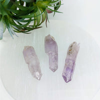 Thumbnail for Veracruz Amethyst LG Point #LV3374: Three beautiful amethyst crystals on a white surface