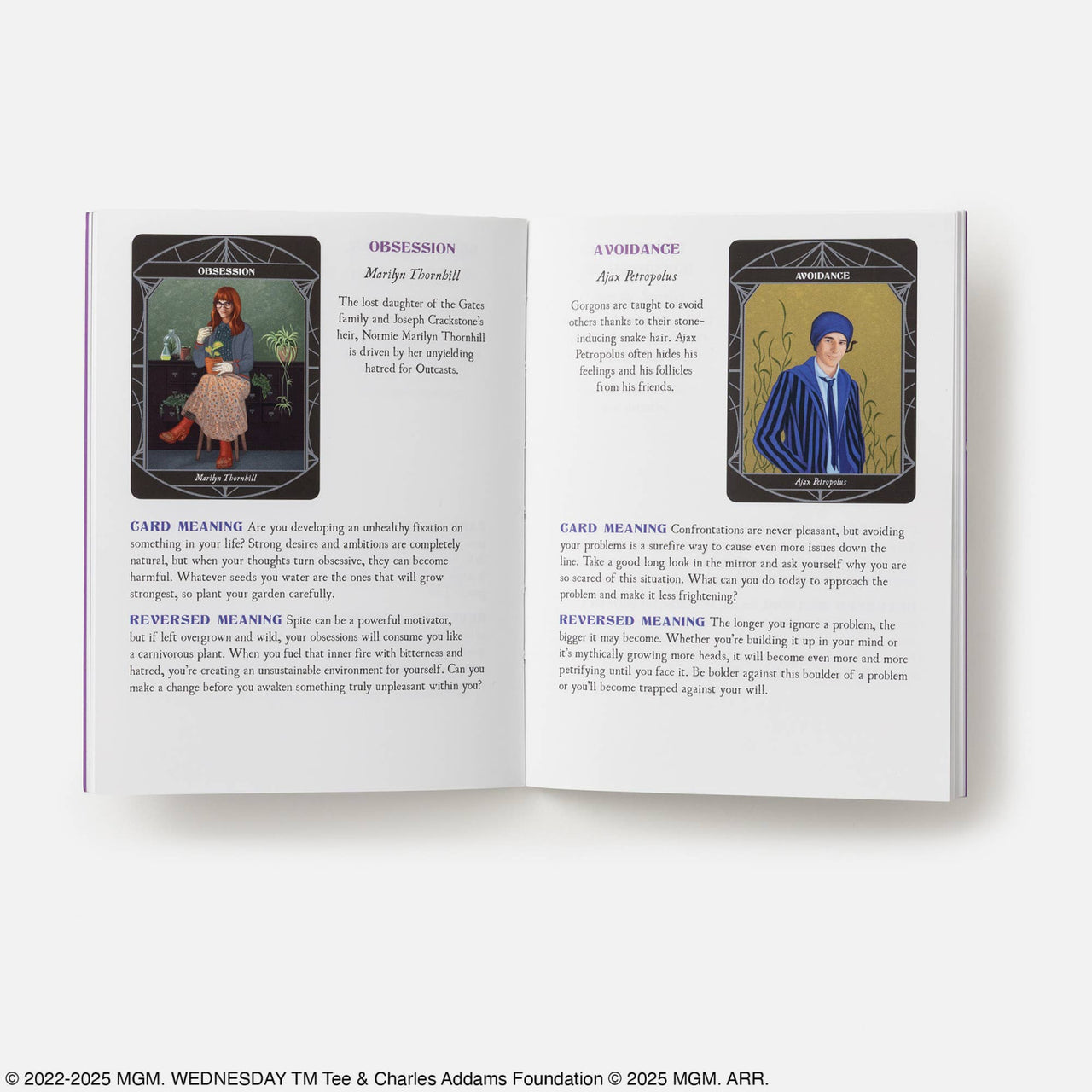 Open book of the wednesday official oracle deck displaying tarot cards obsession and avoidance with crystal-inspired art