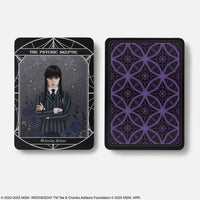 Black Wednesday official oracle deck card featuring the psychic skeptic in dark uniform with silver border and purple crystals pattern back