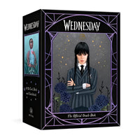 Black and purple Wednesday official oracle deck box with illustrated portrait in striped blazer featuring crystals design