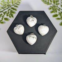 White howlite mini heart pendant featuring four white turquoise gemstone charms with silver metal clasps for jewelry
