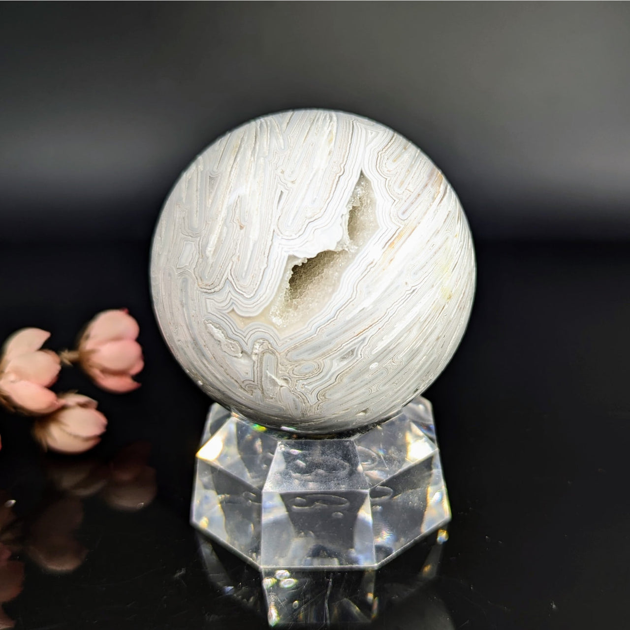 Polished white lace agate 2.5-inch geode sphere on crystal stand