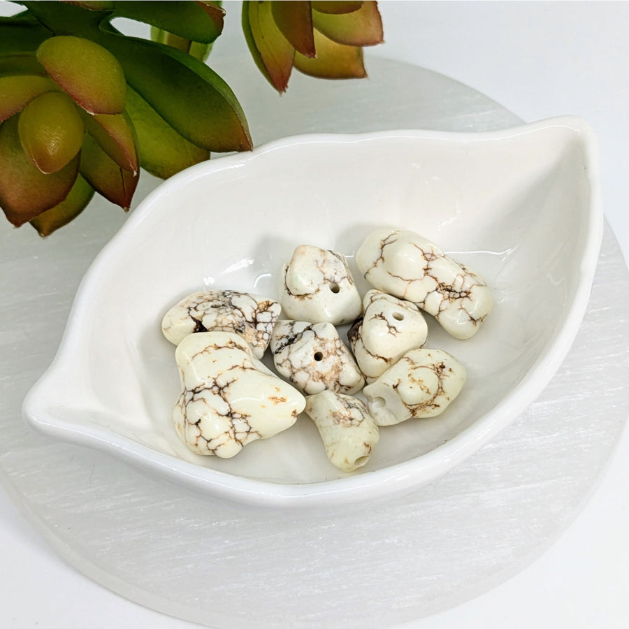White Magnesite 17mm Organic Nugget Beads in a leaf dish with brown veining patterns