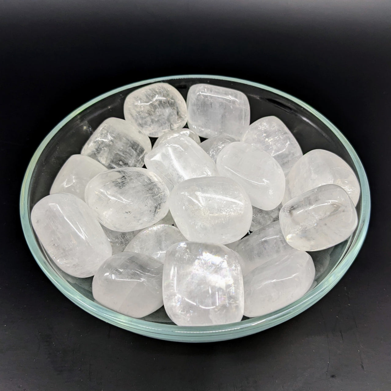 White Optical Calcite Tumbled Stones #LV2716 with clear quartz crystals in a bowl