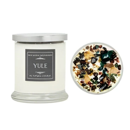 Yule soy candle in glass jar with white wax, green gold accents, crystals