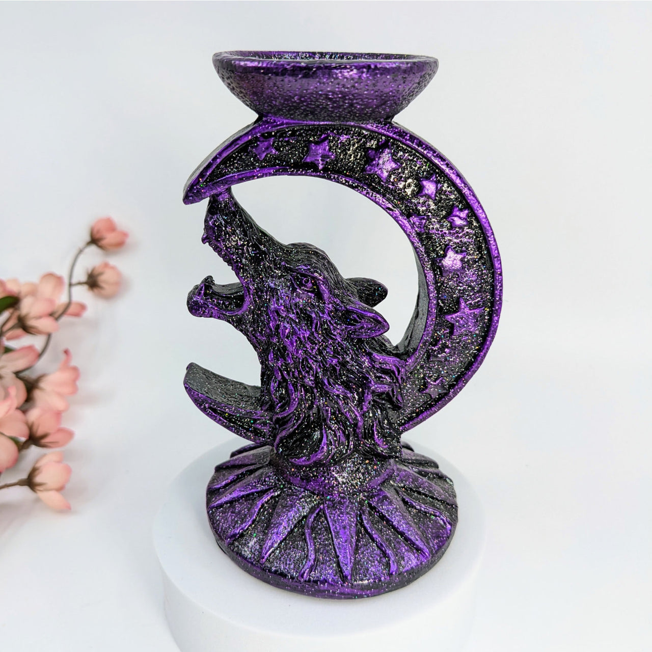 Purple and black Wolf Moon candle holder with howling wolf and crescent moon design