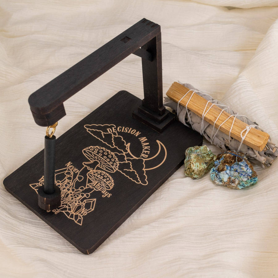 Black decision-making pendulum board from Wooden Decision Maker, Death Moth, Seraphim & Mushroom