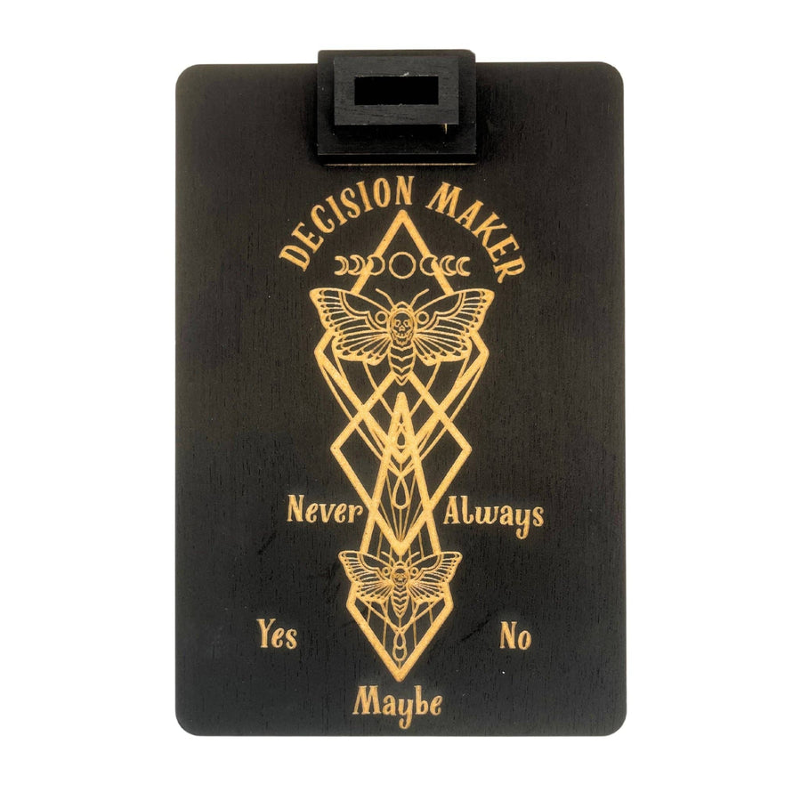 Black wooden decision-making board with a moth and geometric designs for thoughtful choices