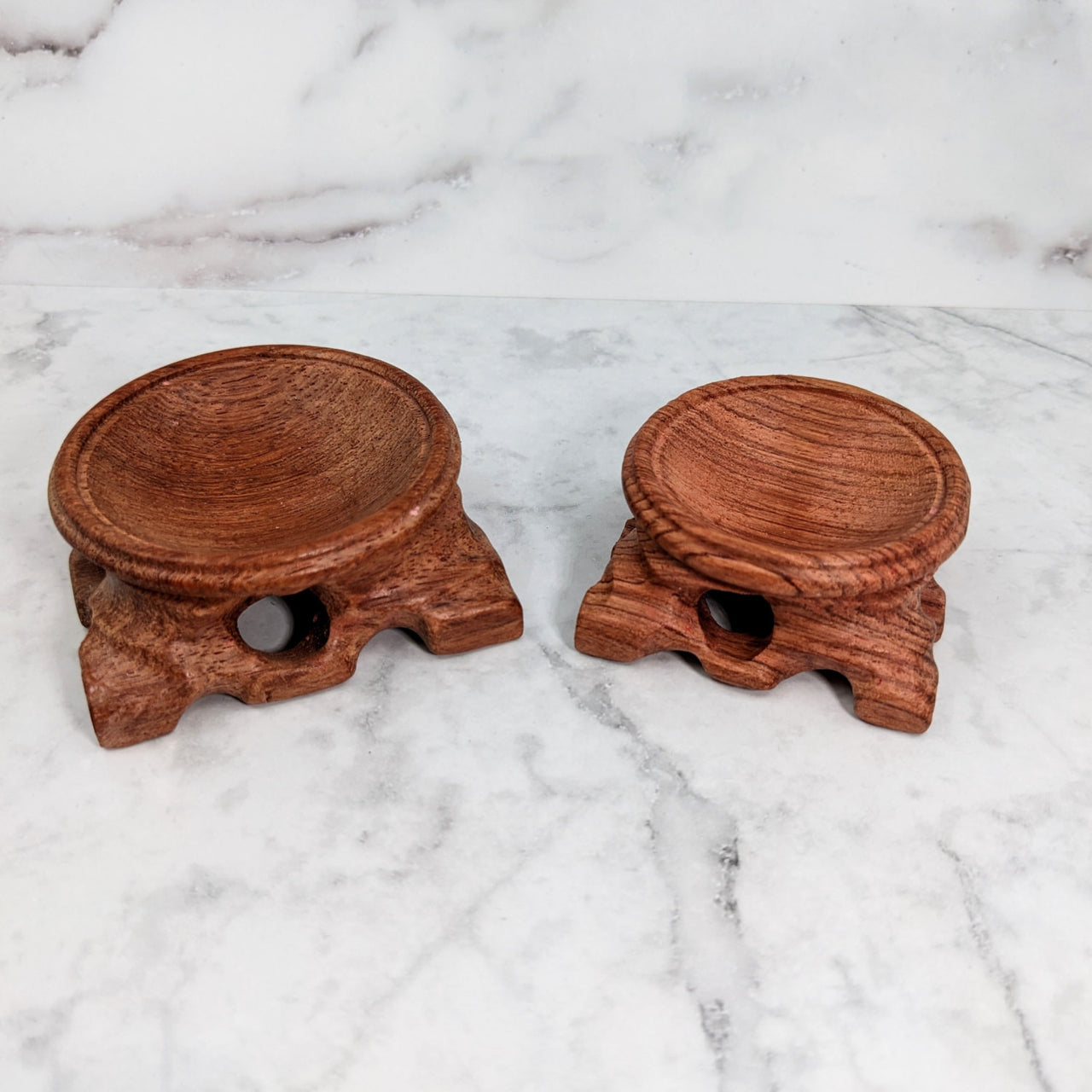 Pair of carved wooden candles on display with Wooden Sphere 2.5-3.3’ Stand #LV2872
