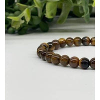 Yellow Tiger’s Eye beaded stretchable bracelet with 6mm beads displayed in product LV8681