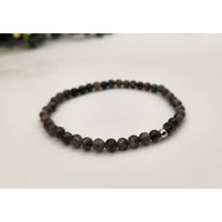 Yooperlite black lava bead stretch bracelet with silver accents 4mm UV reactive