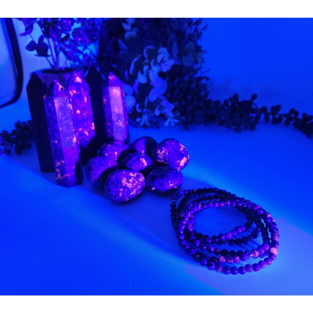 Purple Yooperlite beaded bracelet with black white pattern, UV reactive