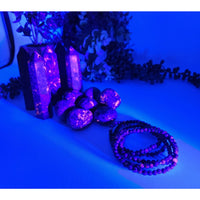 Purple Yooperlite beaded bracelet with black white pattern, UV reactive