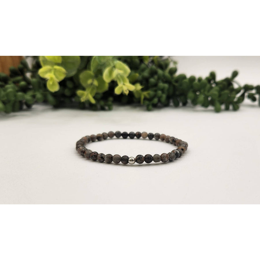 Black lava stone beaded bracelet with silver accent, 8mm UV reactive Yooperlite