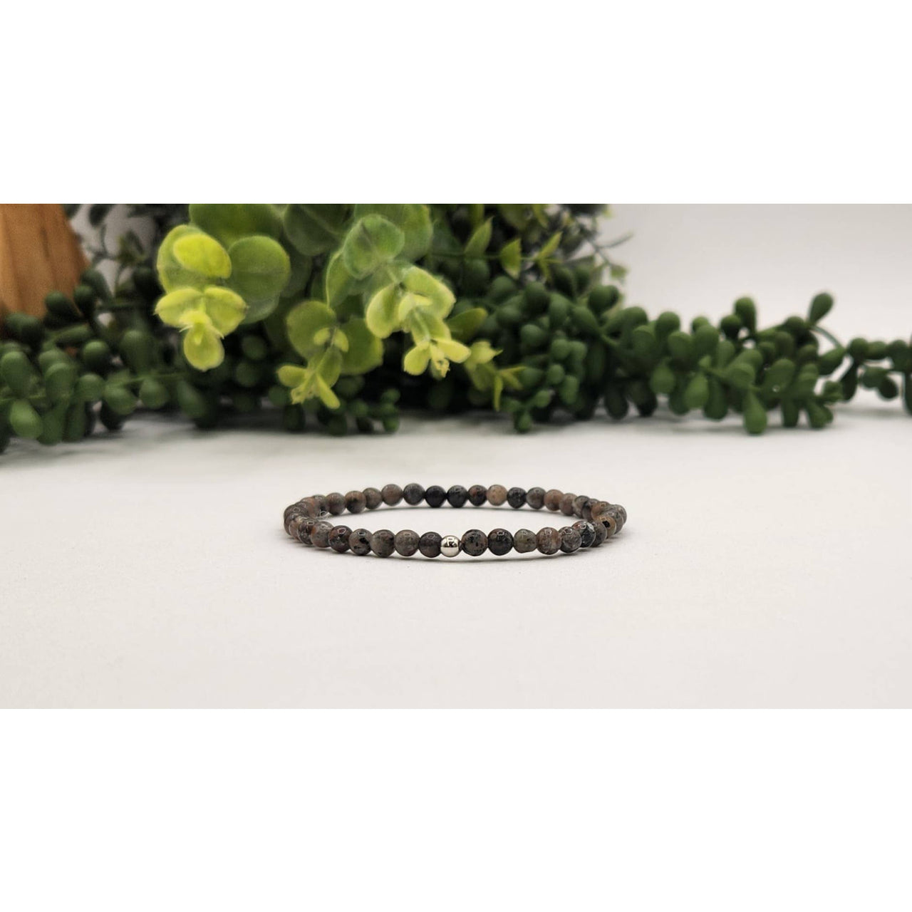 Yooperlite lava bead stretch bracelet with black beads, silver accents, UV reactive