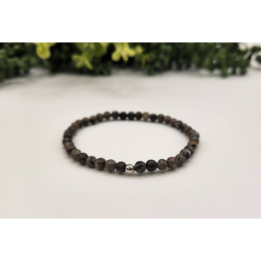 Black lava bead bracelet with silver accent, matte Yooperlite UV reactive 4mm