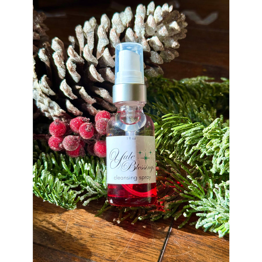Yule Blessings 1oz Cleansing Spray in clear glass bottle with red liquid
