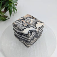 Thumbnail for Marble-patterned zebra calcite 1.5’’ cube showcasing swirling black and white designs