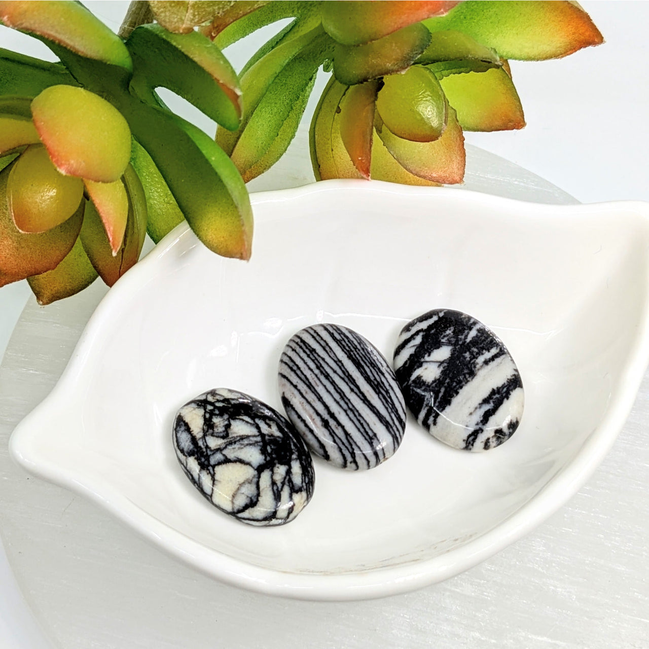 Three Zebra Jasper 25mm oval beads with unique black and white swirled patterns