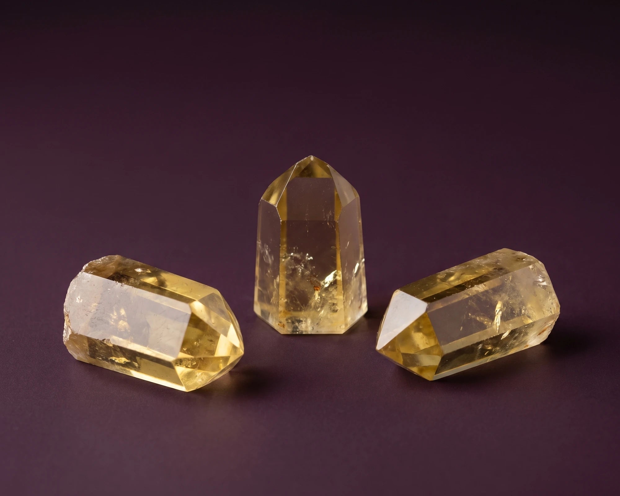 Golden citrine points aligned with the solar plexus chakra diagram backdrop.