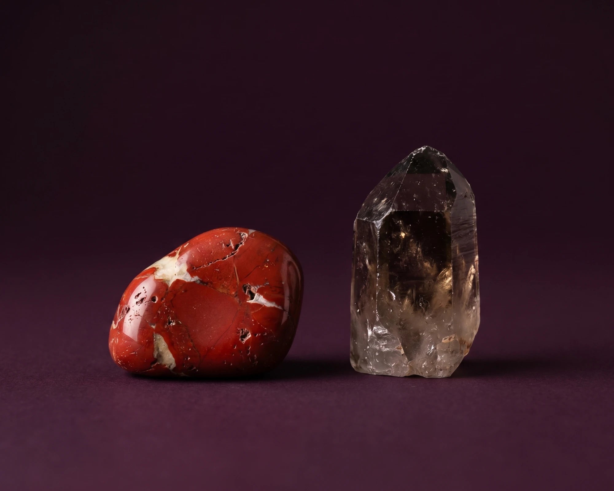 Raw red jasper and black tourmaline anchoring the root chakra connection.