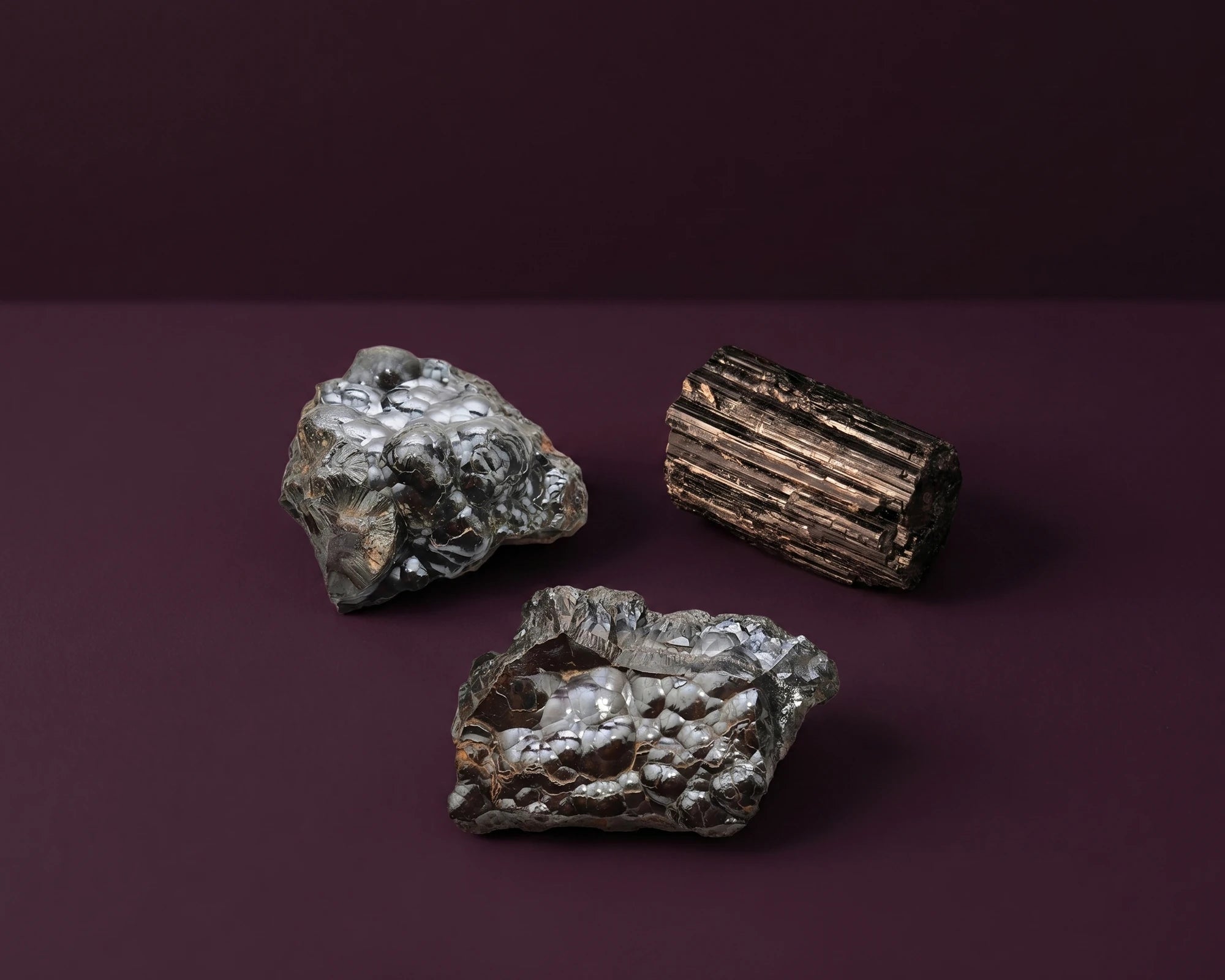 Smoky quartz and dark obsidian stones for root chakra protective shielding.